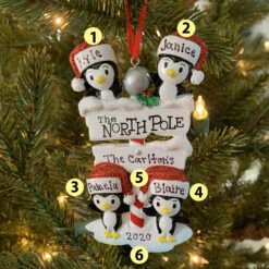 Penguin Family Of 4 At The North Pole Personalized Christmas Ornament OR1739-4
